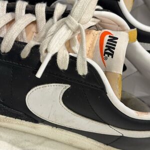 Nike Men's Black and White Sneakers with Orange Accent